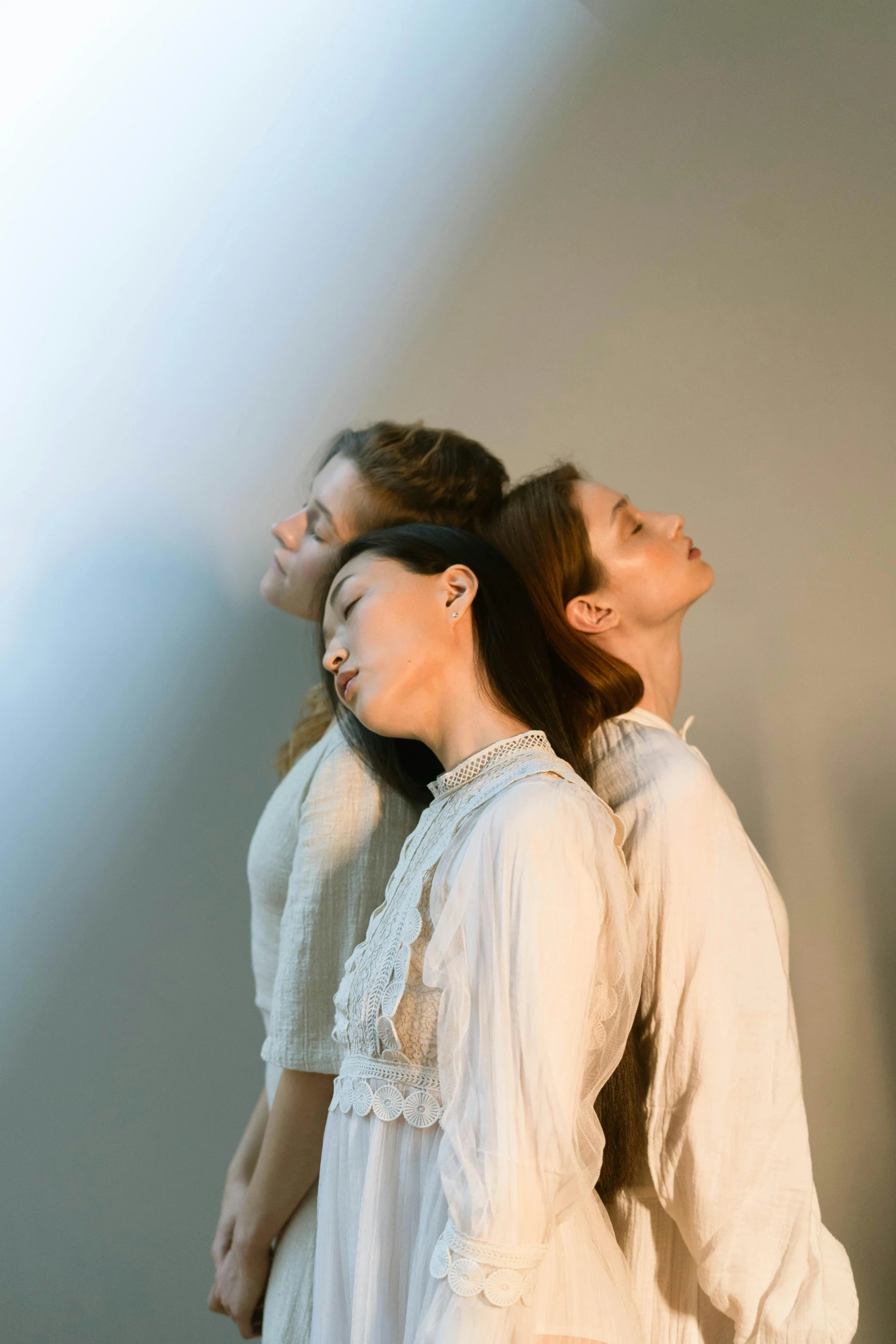 a woman holding another woman's head in their hair