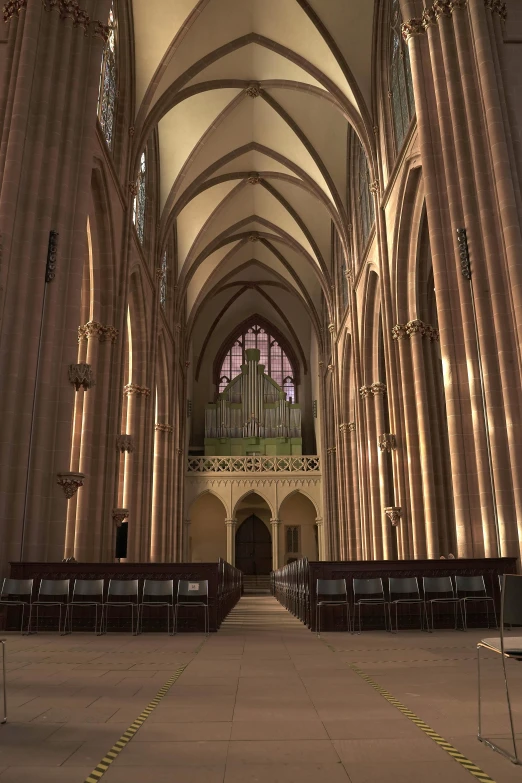 a long cathedral filled with rows of pews