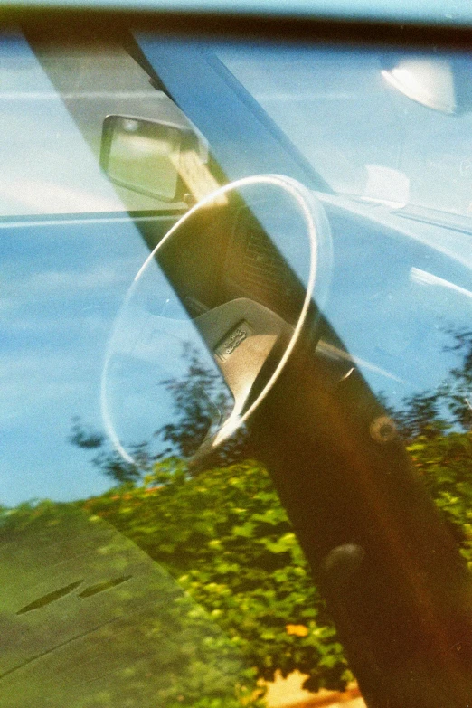 a close up of the reflection of a person riding a skateboard