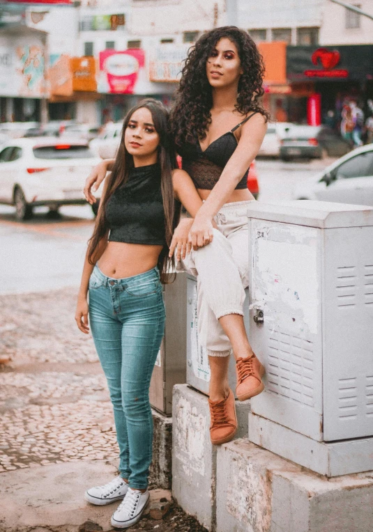 two beautiful women standing near each other