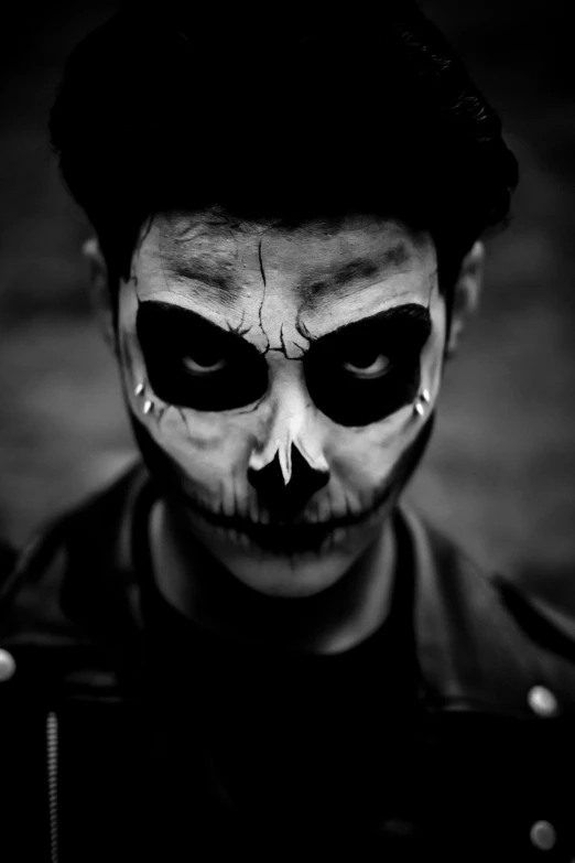 a man in costume poses with his face painted black