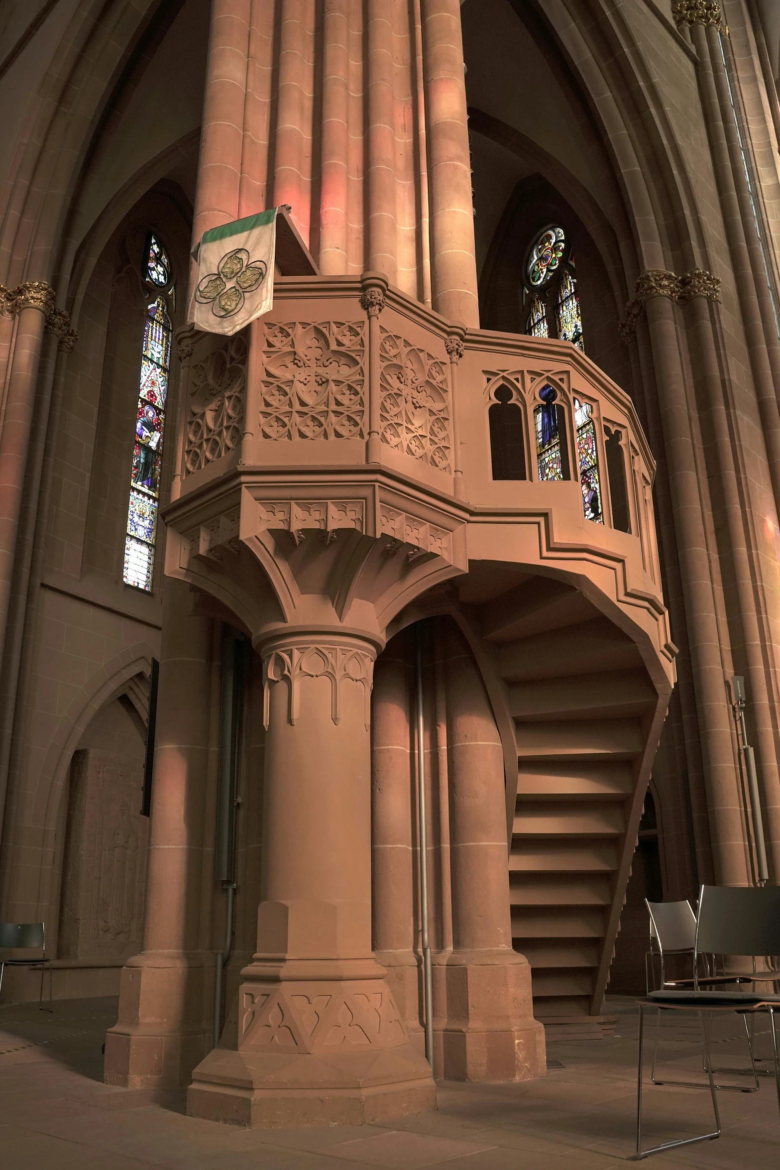 the interior of a cathedral with a tall staircase