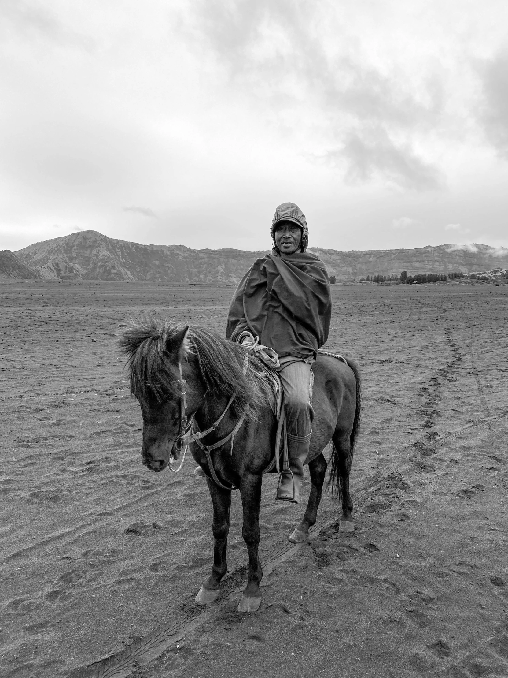 a man riding on the back of a black horse