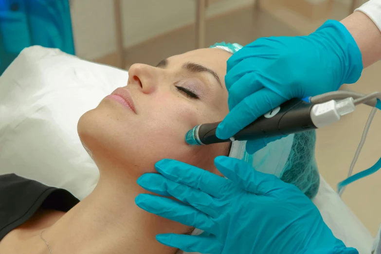 a woman getting a procedure on her face