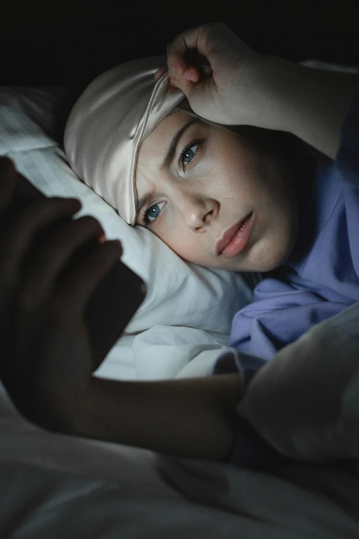 a child in bed looking at the camera