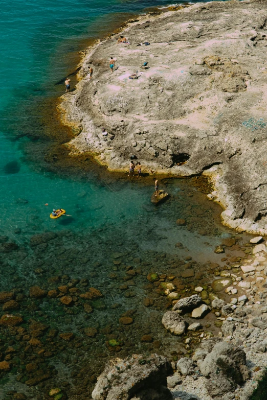 a couple paddle boats out of the clear blue water