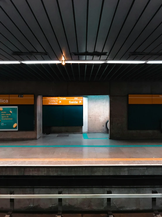 a subway station with a man standing in the doorway