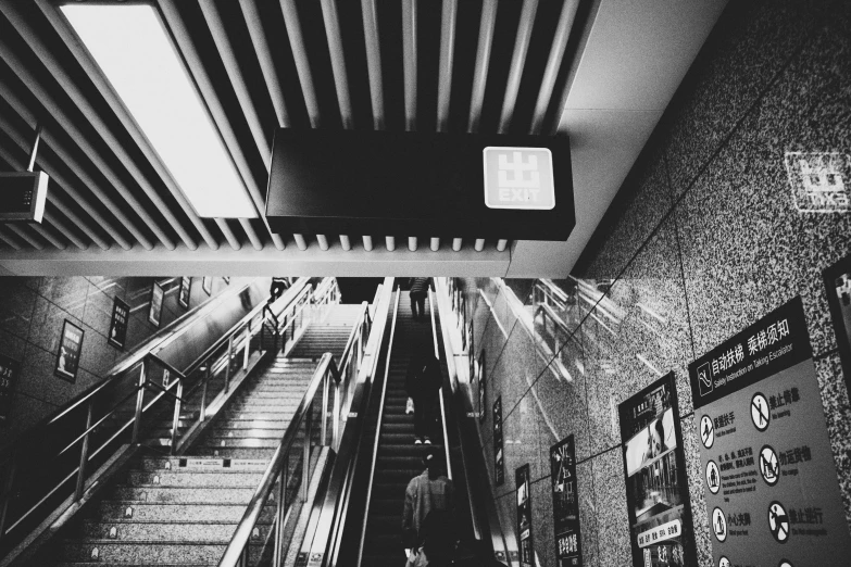 black and white pograph of the escalator between two buildings