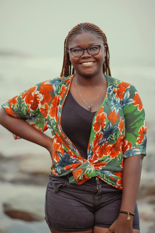 a woman with her hands on her hips posing for the camera