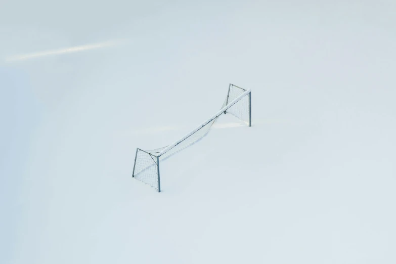 an aerial view of a net in the snow