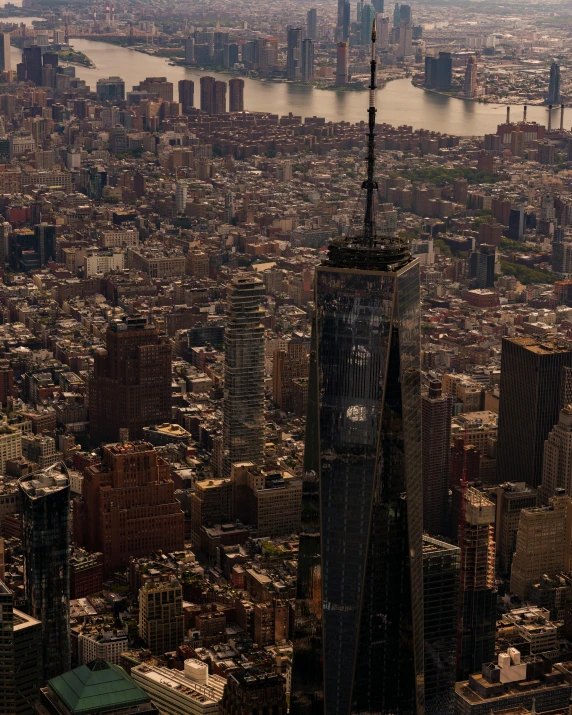 aerial view of city with skyscrs and water