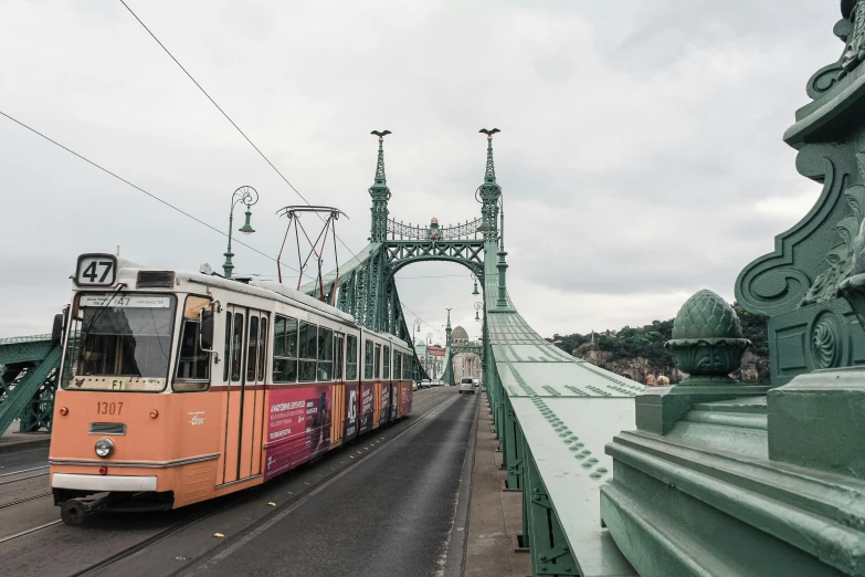 a bus going over a bridge on the road