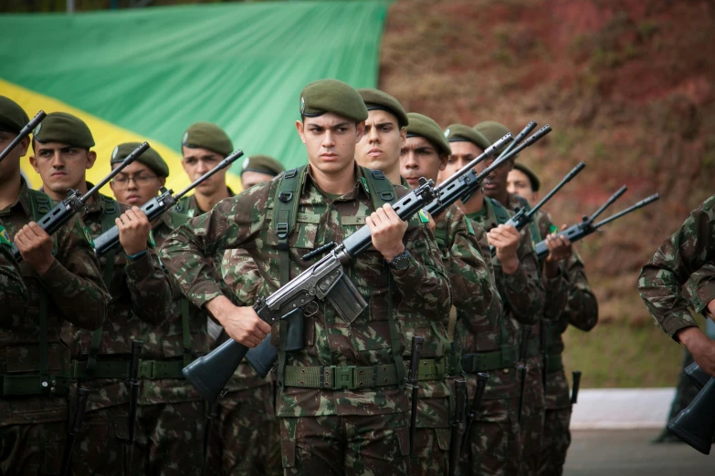 a group of soldiers with a gun in their hand