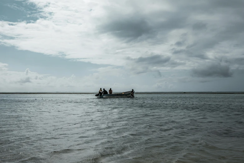 the couple are riding in the small boat out on the water