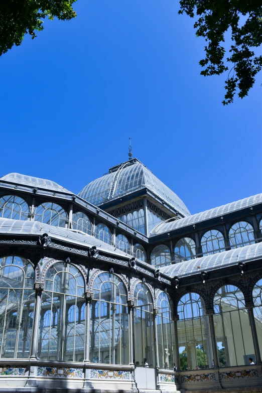 a very pretty building with some large windows