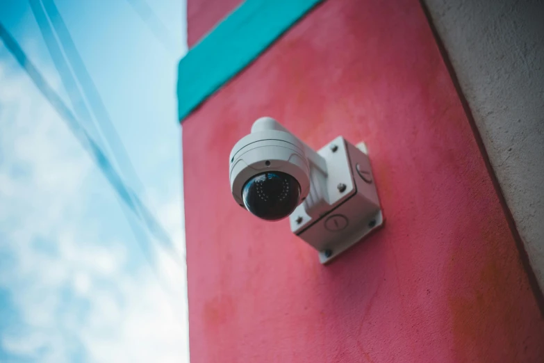 a camera on the side of a building