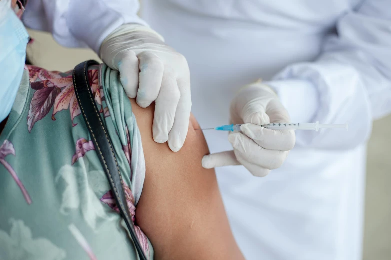 close - up of doctors'hands touching the abdomen of an injured woman