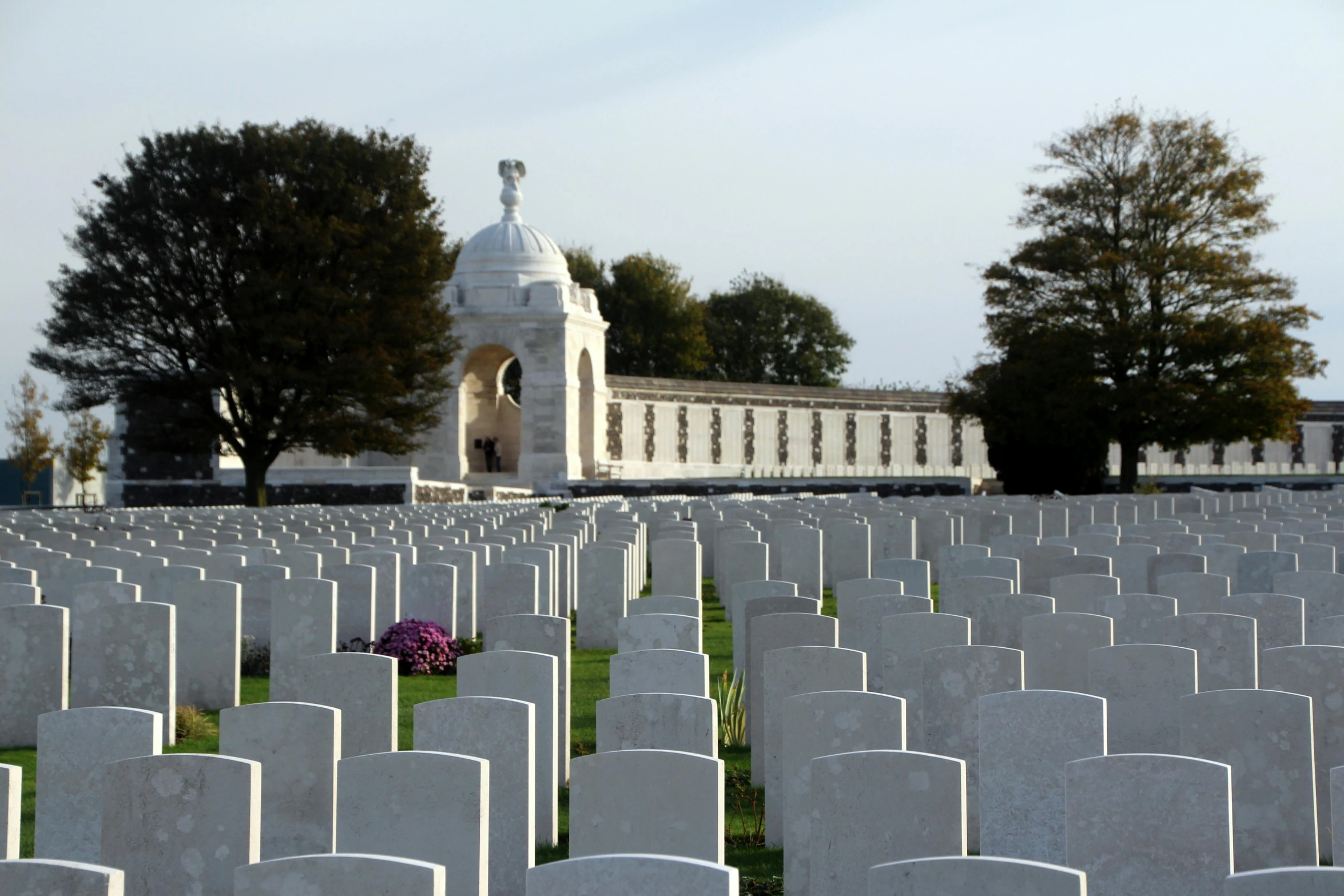 a war cemetery in the middle of a field