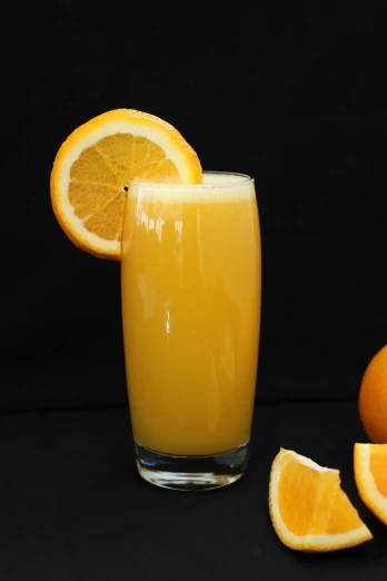 an orange juice has been squeezed into a glass