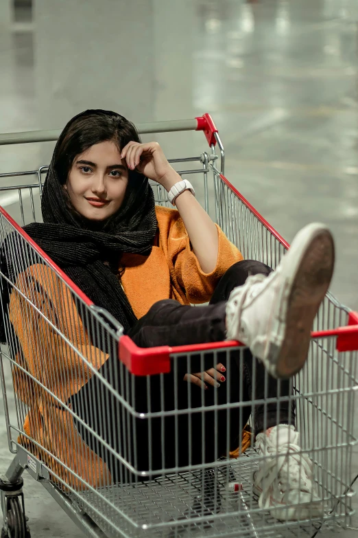 a person sitting in a shopping cart looking up