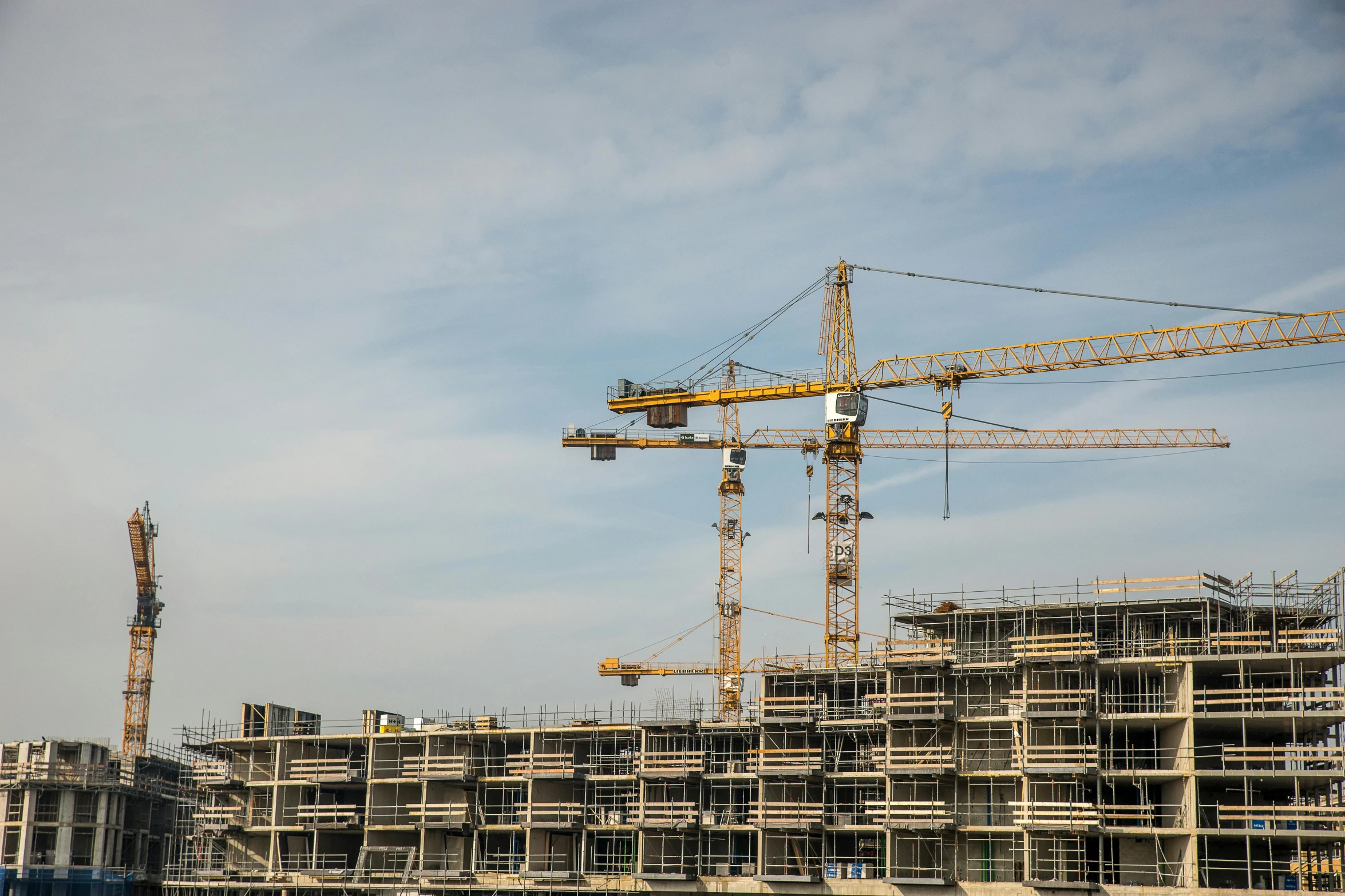 a crane standing at the top of a building