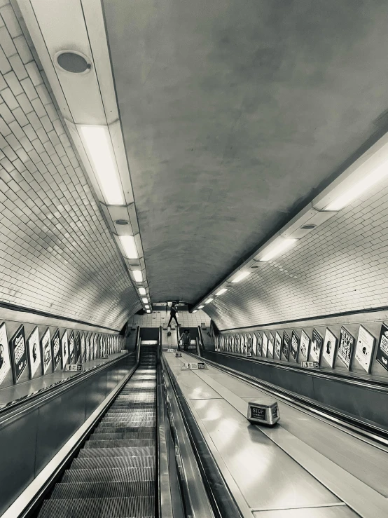 long lines of empty moving down an escalator