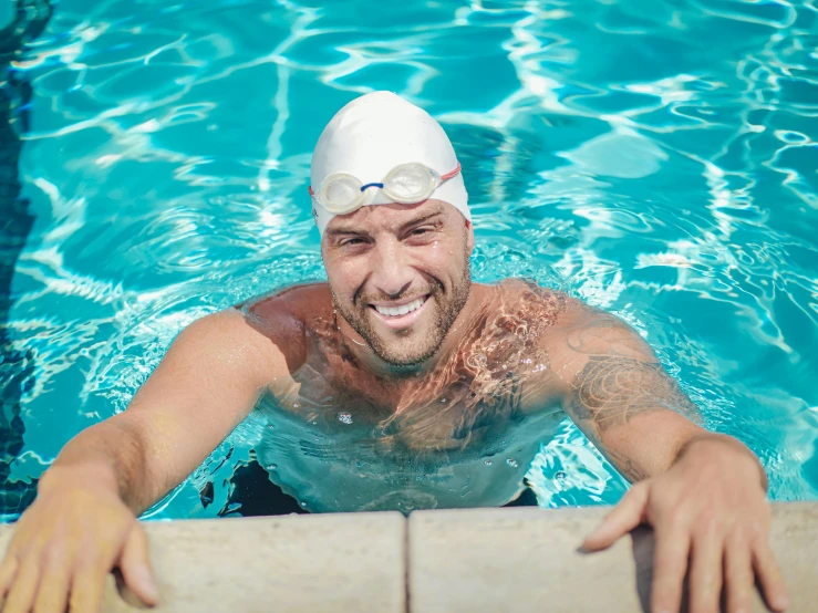 an image of man in swimming gear taking a swim