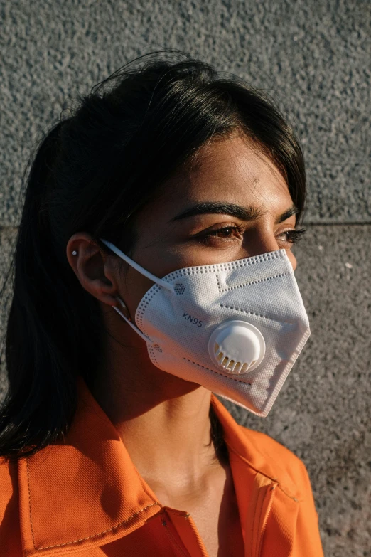 a woman wearing a mask with a white on