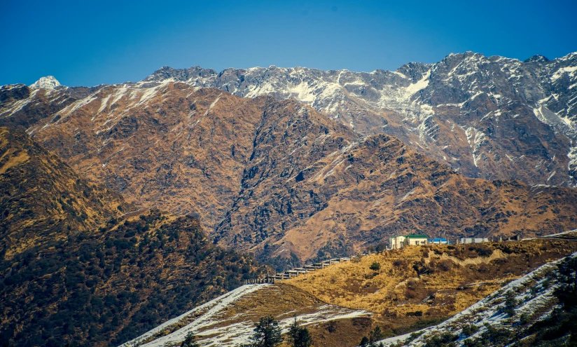 the mountains are covered with a layer of snow