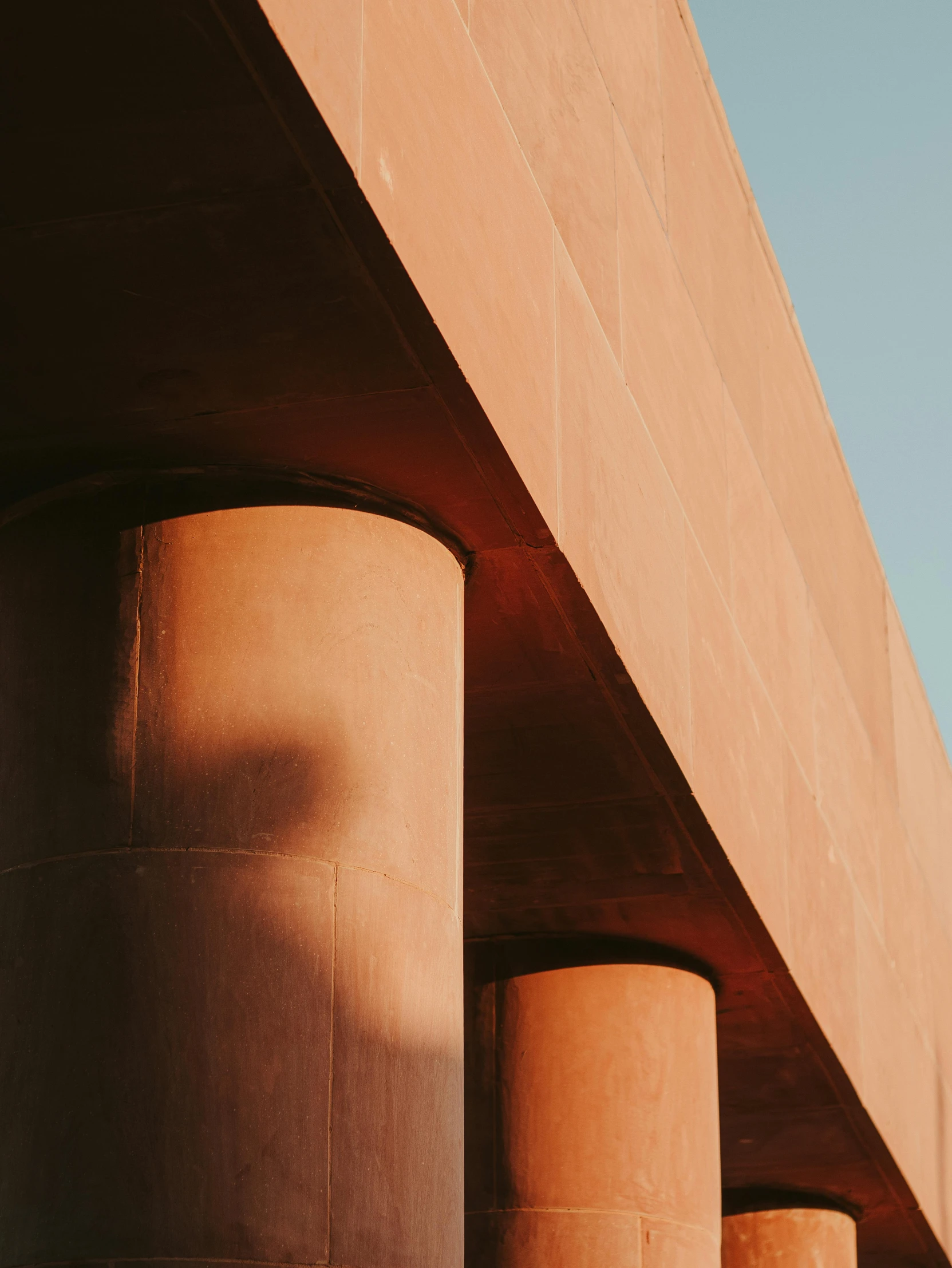 a large cement structure with three pillars