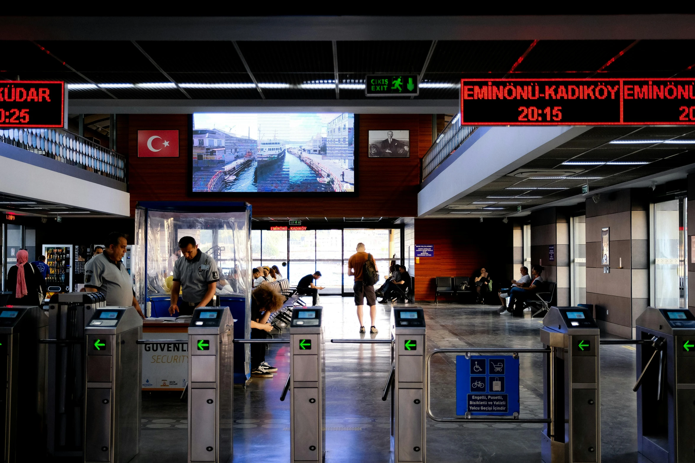 travelers waiting on their luggage at the gate at the terminal