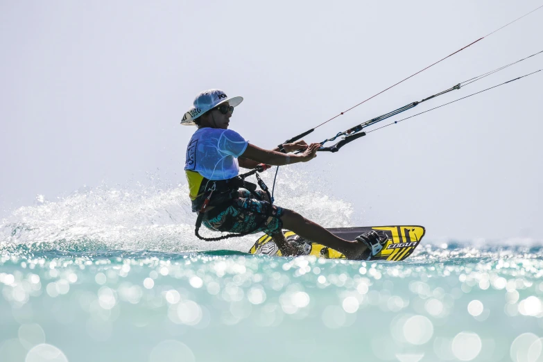 a man riding a wave kiteboard on top of the ocean