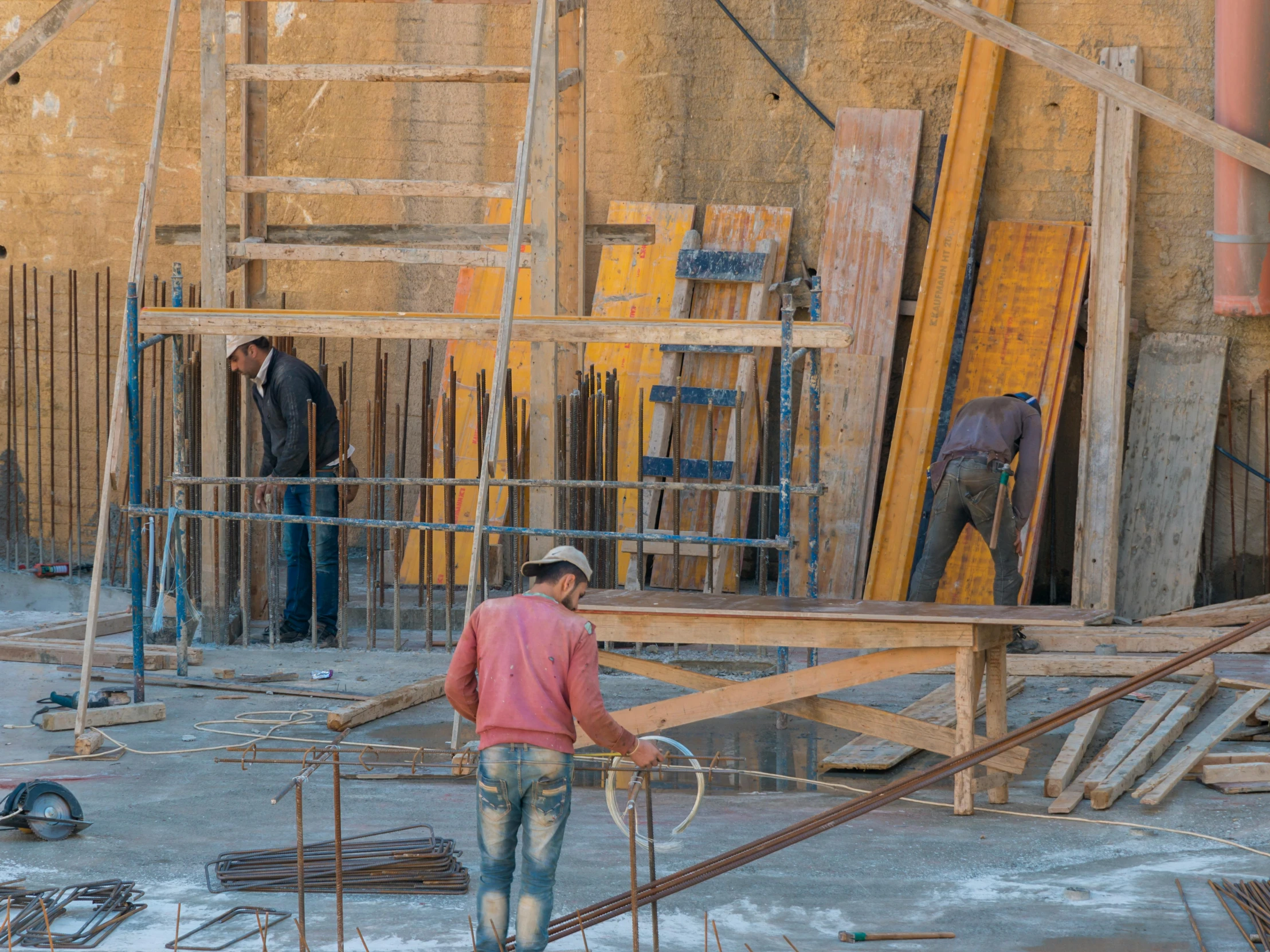 the two men are working in the construction site