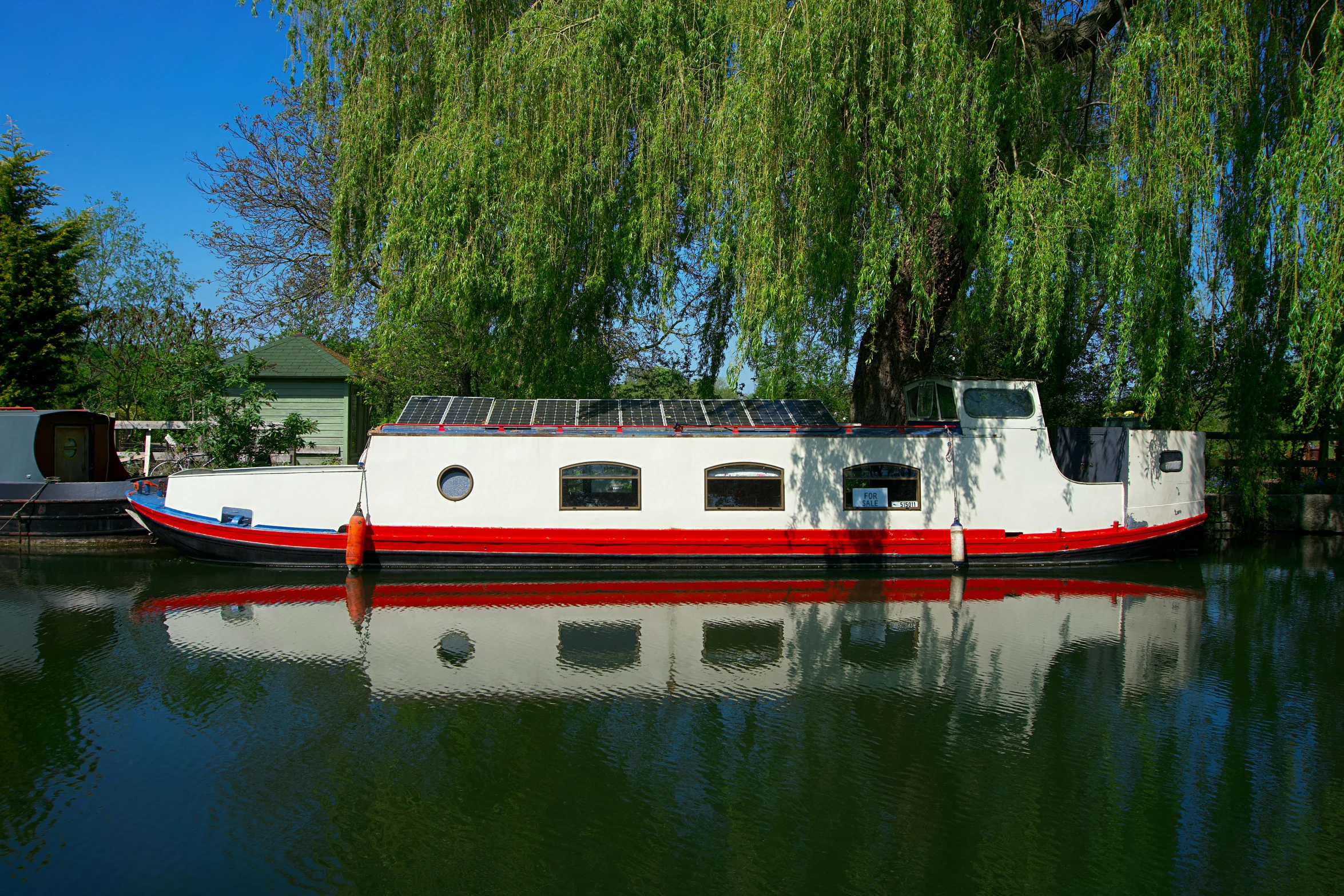 a small barge that is moored at a dock