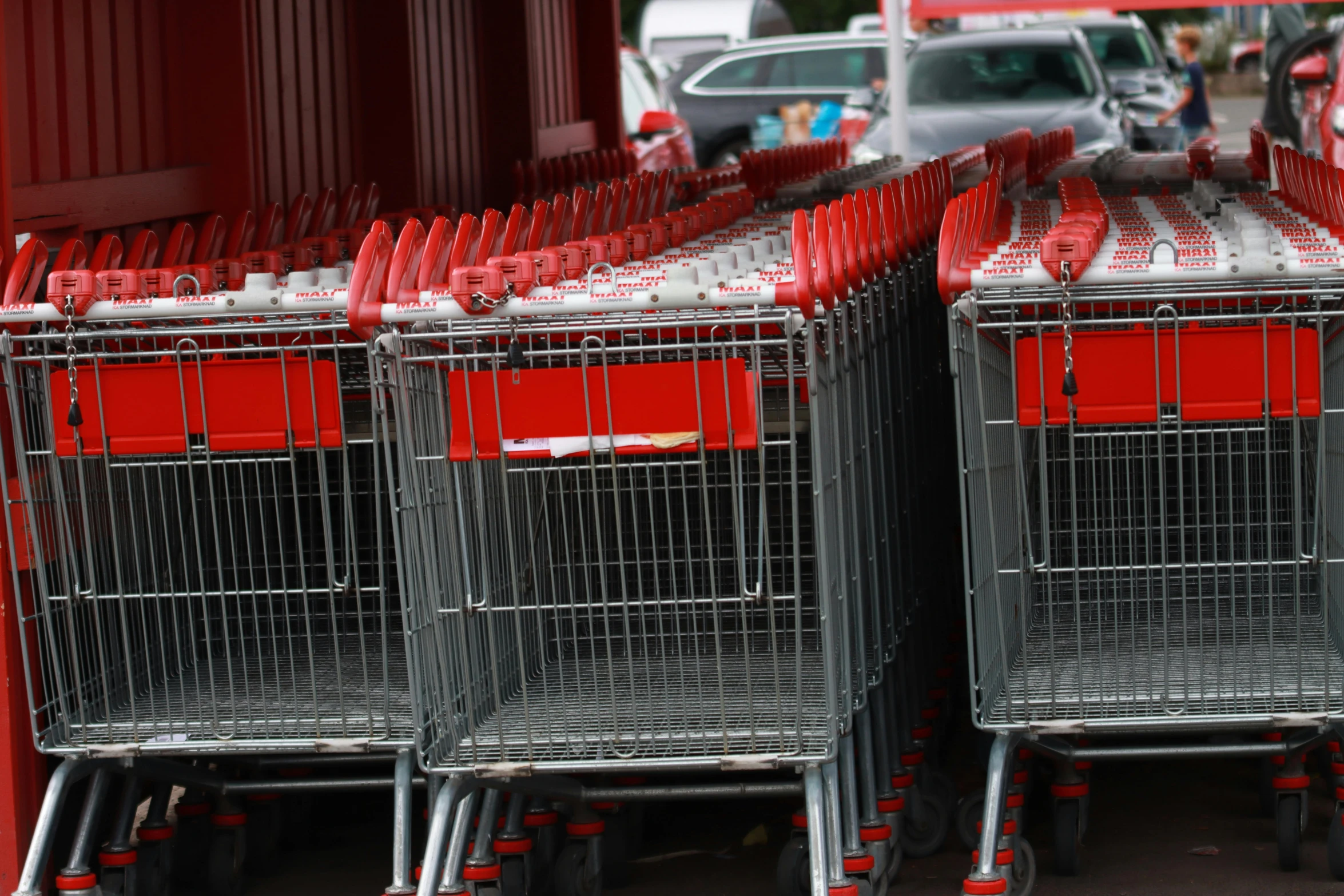 several shopping carts are lined up for sale