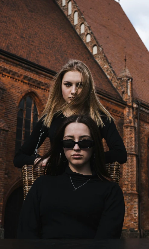 two young women, one with sunglasses on top of her head