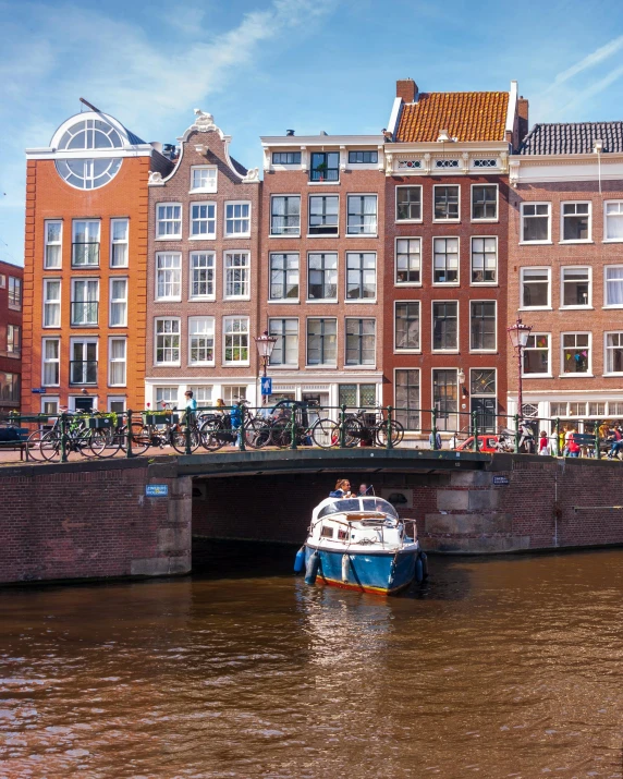 a canal with a barge and two bikes on the side of it