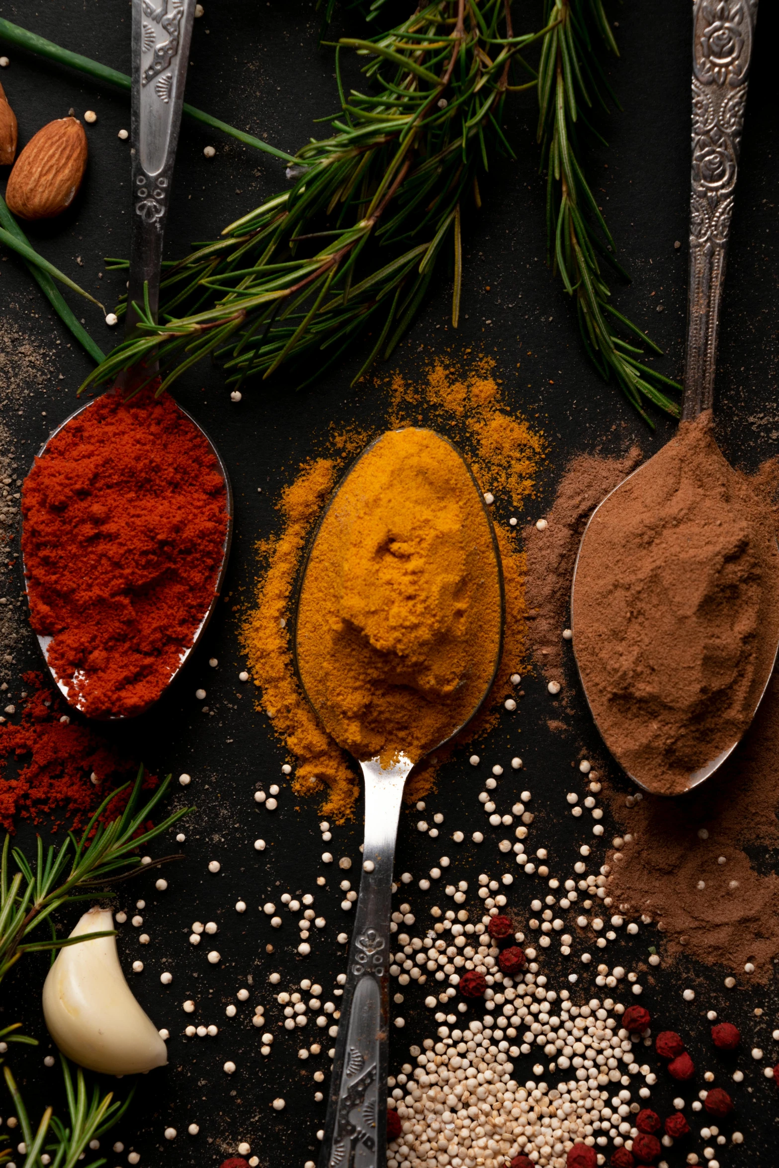 there are various herbs and spices arranged on this table