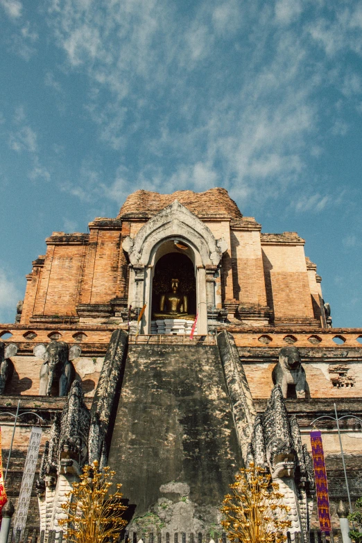 an ancient temple with the blue sky in the background