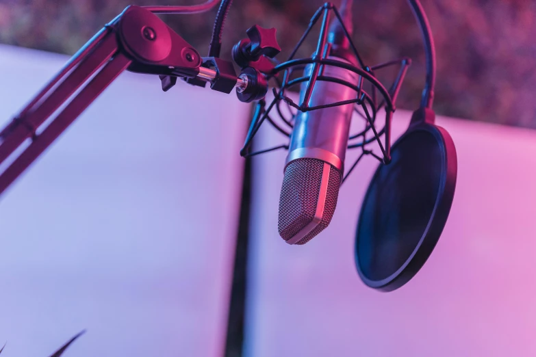 a microphone attached to a wall with a boom box in the background