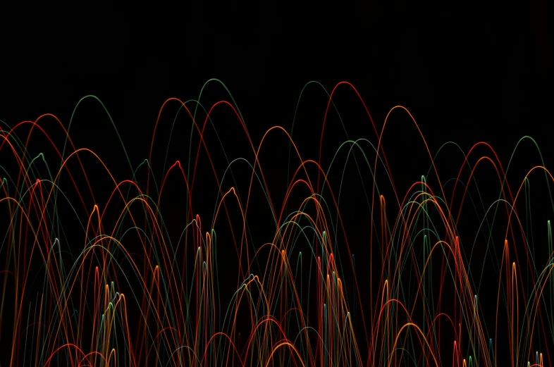 a large display of neon colored wire with lots of lights
