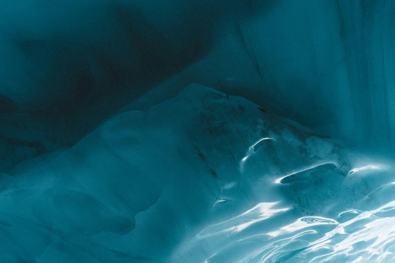 light streaks in an ice cave on the surface of water