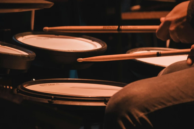 a drum player is seen playing on the drums