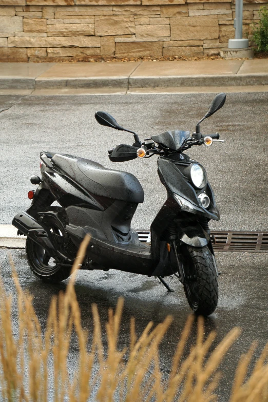 a scooter is parked near a parking lot