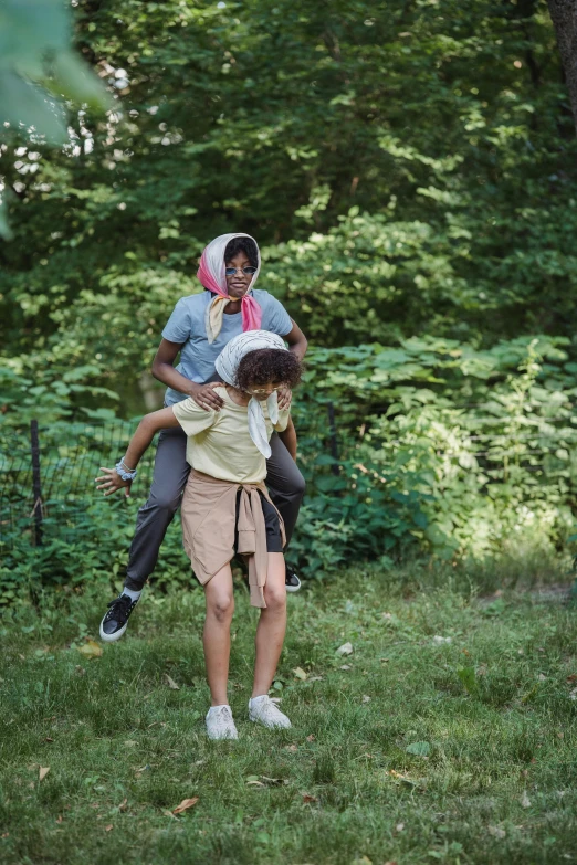 two people are having fun in the woods