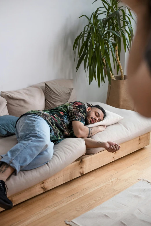 a man on the couch taking a nap