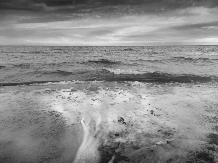 an ocean scene with strong waves in the water