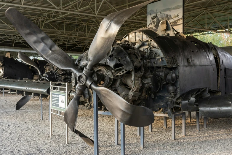 an old engine sitting on display in a hangar