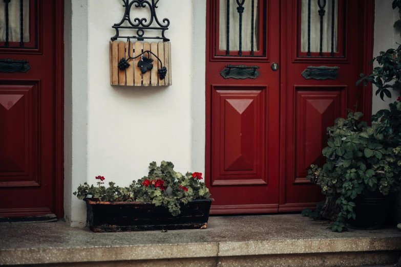 the front door of a home with two red doors