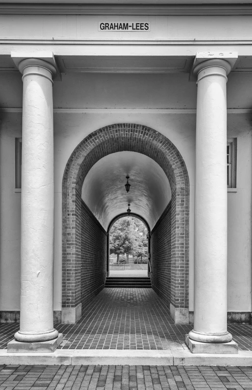 black and white pograph of an arched walkway in the building